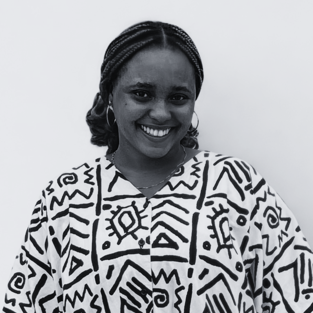 Carren, Lustnfree’s financial manager, wearing a geometric-patterned shirt, posed against a plain background.