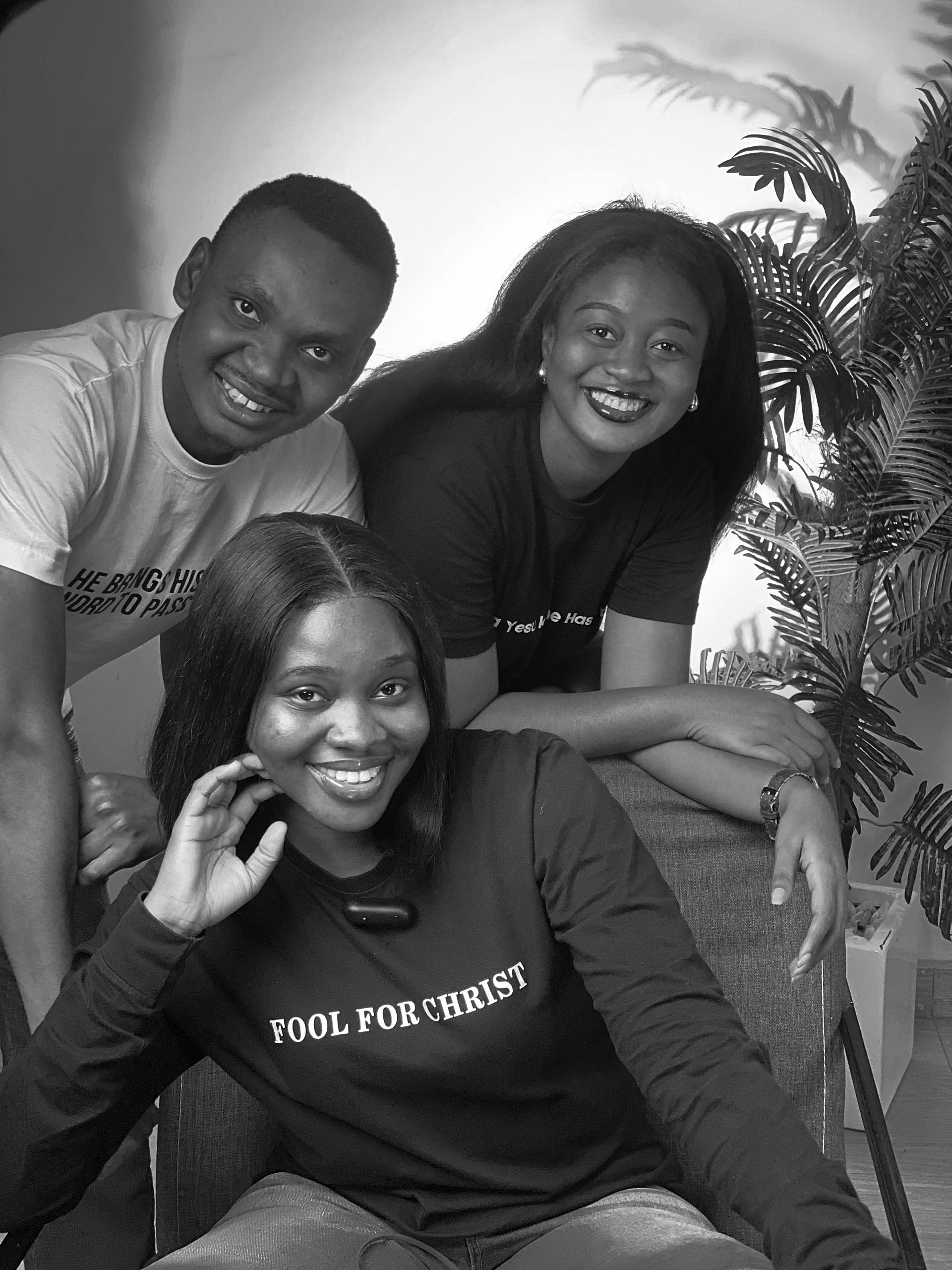 Three Lustnfree team members smiling and posing together for a group photo.